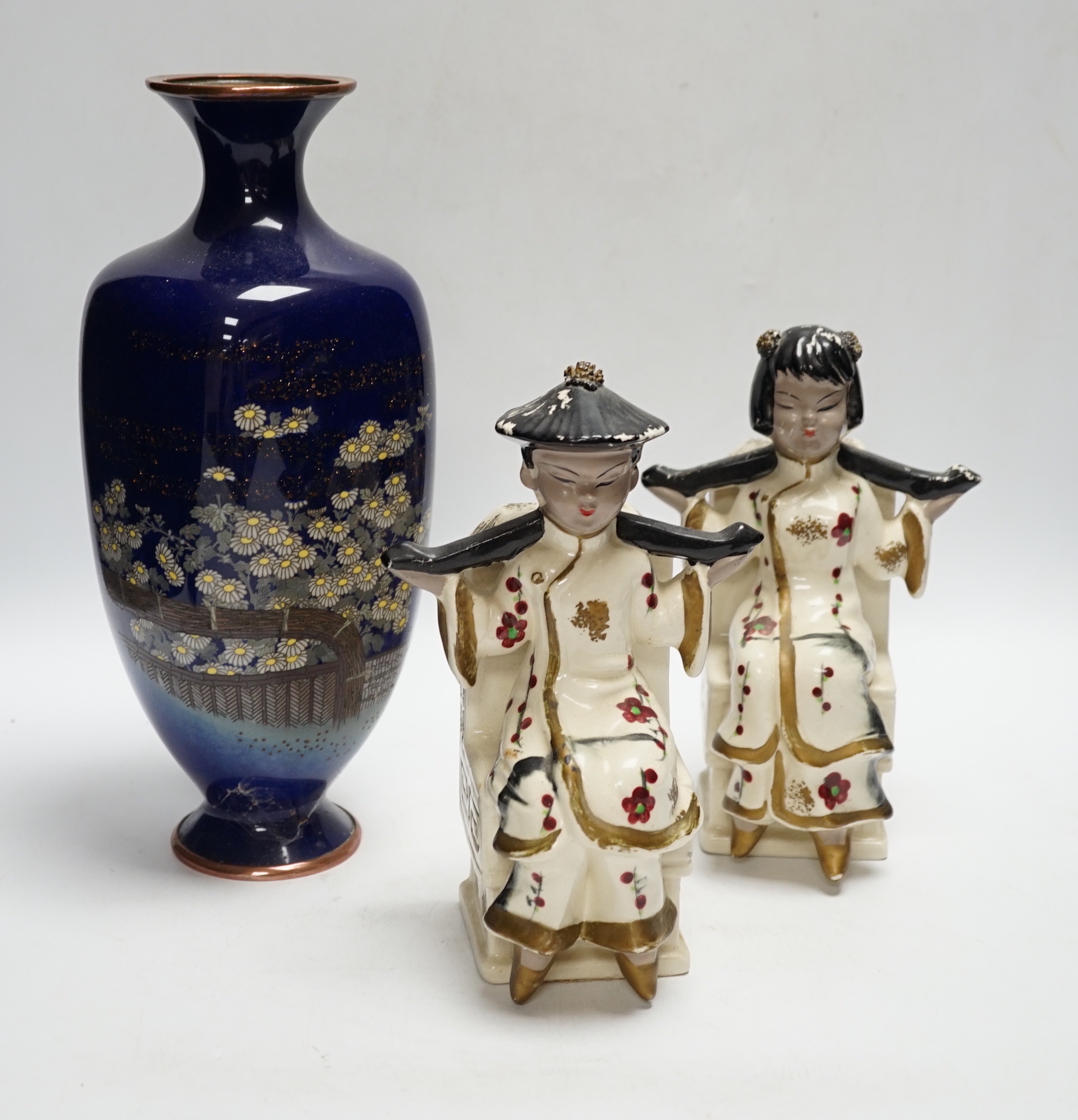 A pair of Japanese earthenware bookends and a Japanese cloisonné enamel vase, decorated in the musen and silver wire technique, vase 30cm